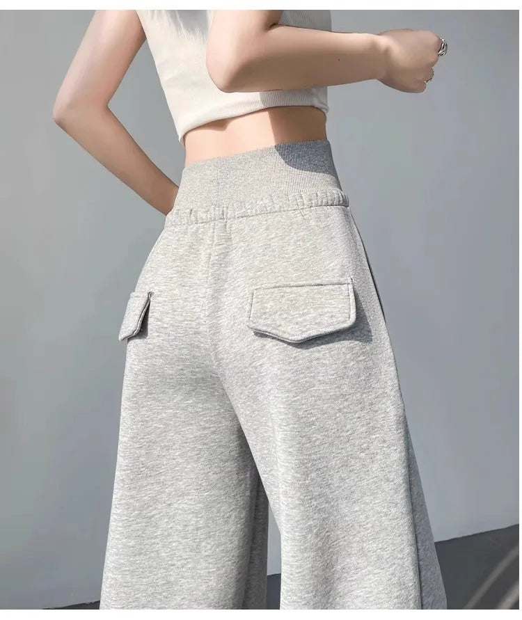 Damen graue Sporthose mit hohem Bund, locker hängend, schlank machend, gerade geschnittene weite Hose, amerikanische Jogginghose.