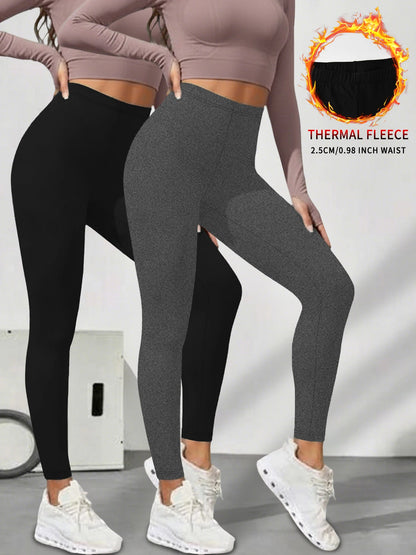 2er-Pack Damen-Leggings mit niedrigem Bund aus Fleece und Thermotechnologie. Für Winterlauf und Yoga konzipiert, hält während des Trainings warm